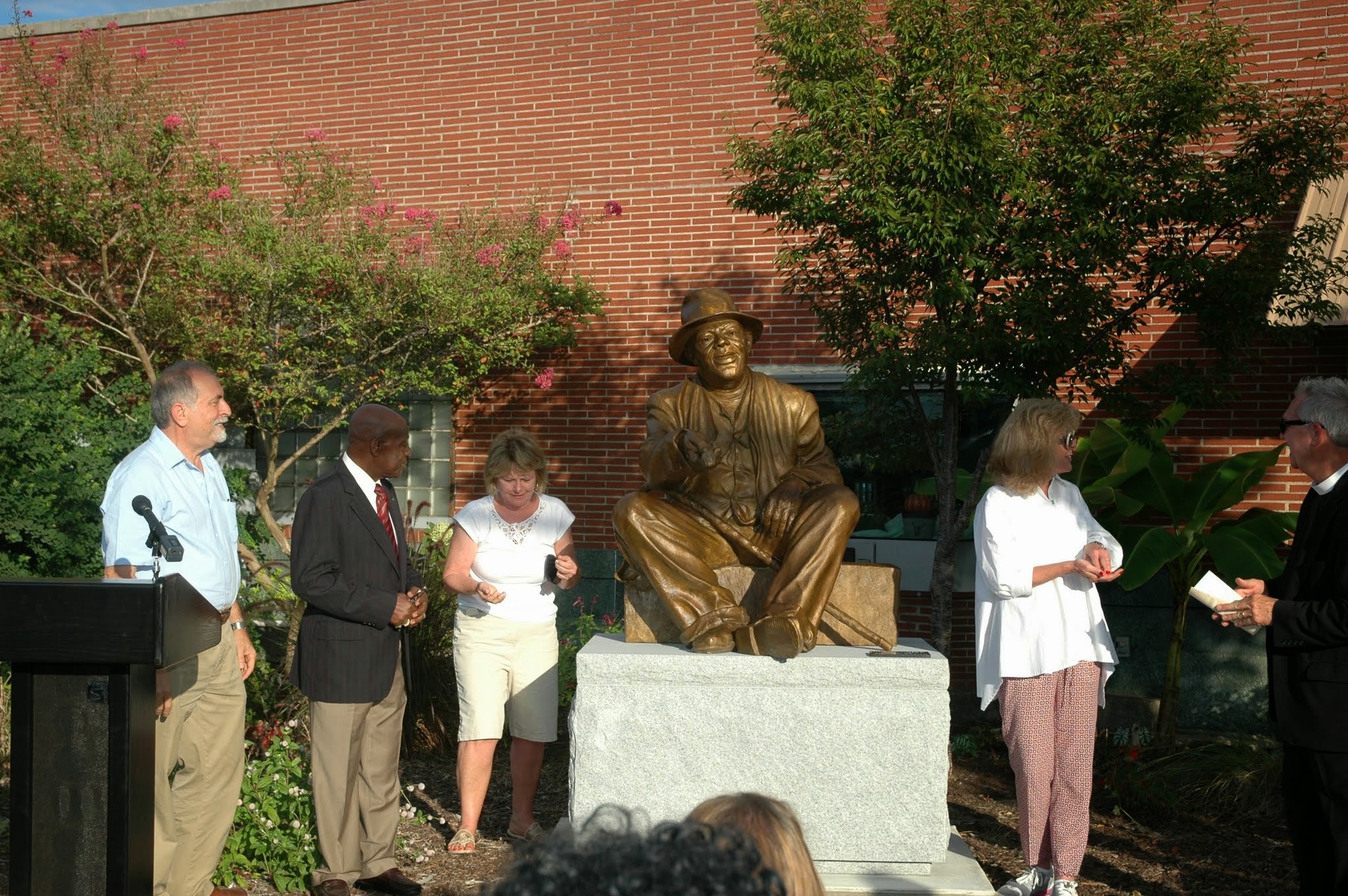 Attendees taking a close look at the sculpture