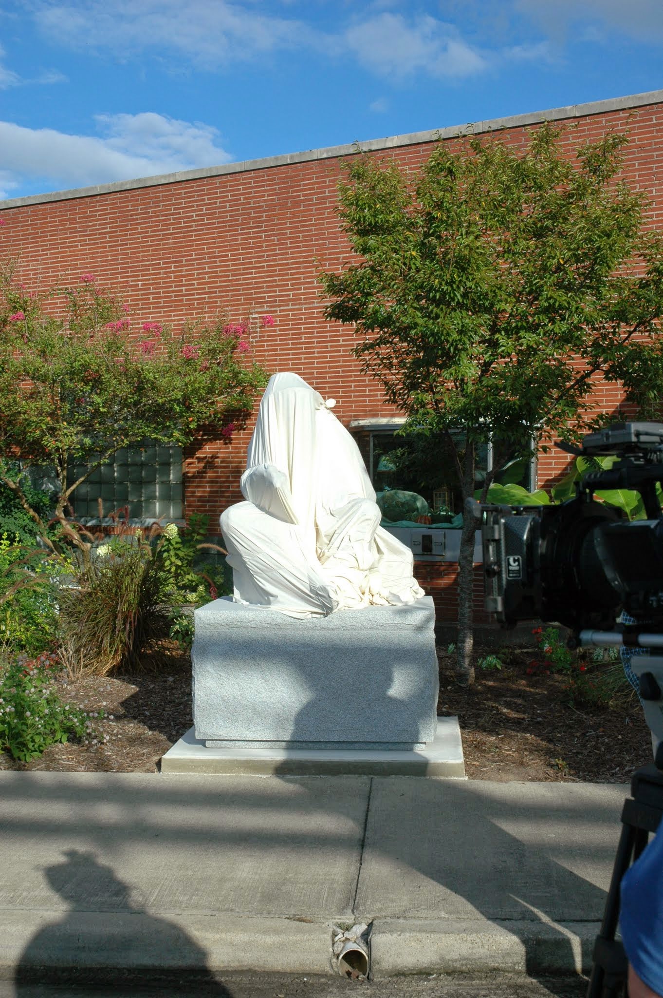 The sculpture wrapped prior to unveiling