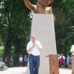 Alex Palkovich speaking in front of the newly unveiled sculpture