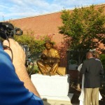 People admiring the sculpture now that it has been unveiled