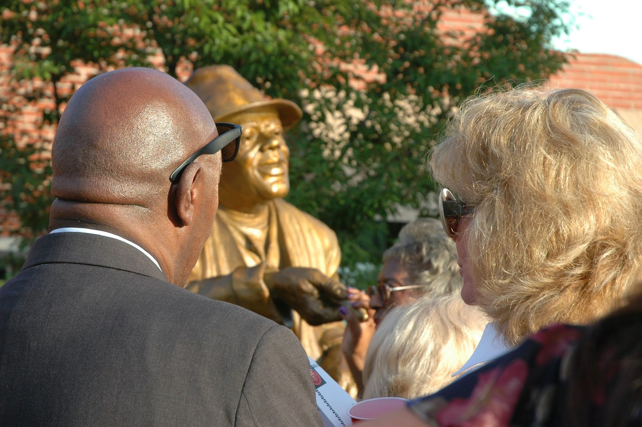 Darla Moore viewing the Huey Cooper sculpture Sept. 10, 2014 at the unveiling