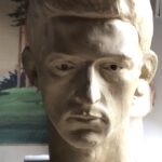 Early sculpture of a young man